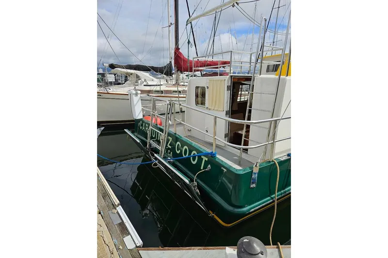 Carquinas Coot Yacht Photos Pics Seahorse COOT 2010 boat docked at marina, featuring green hull and open cabin.