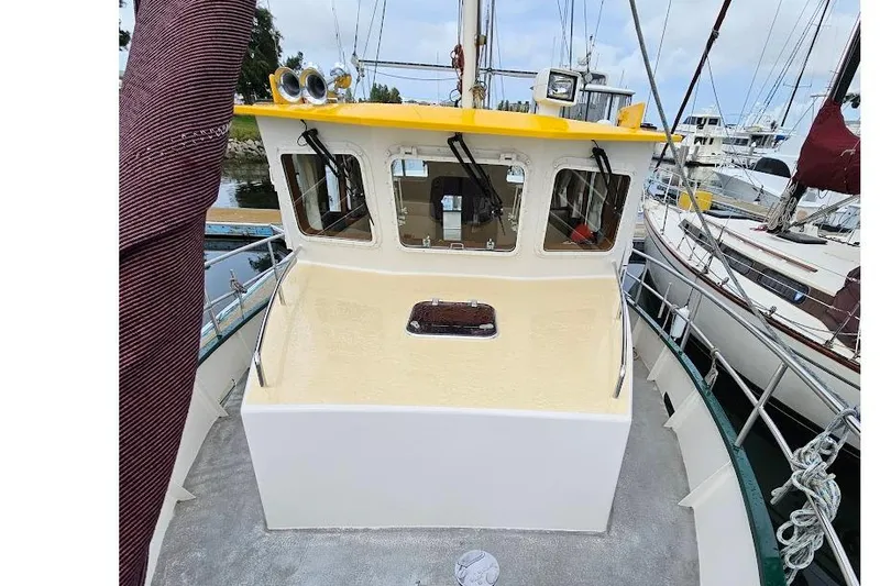 Carquinas Coot Yacht Photos Pics 2010 Seahorse COOT boat with yellow roof, docked among other vessels.