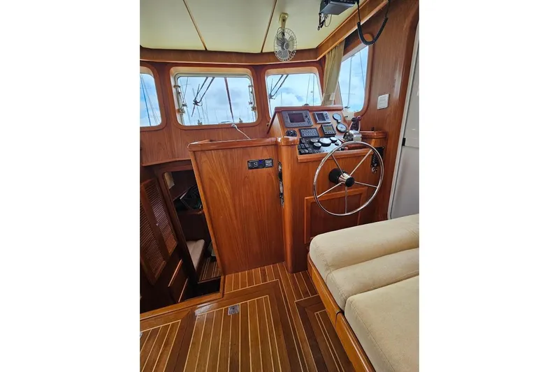 Carquinas Coot Yacht Photos Pics Interior of 2010 Seahorse COOT boat with wooden helm and navigation instruments.