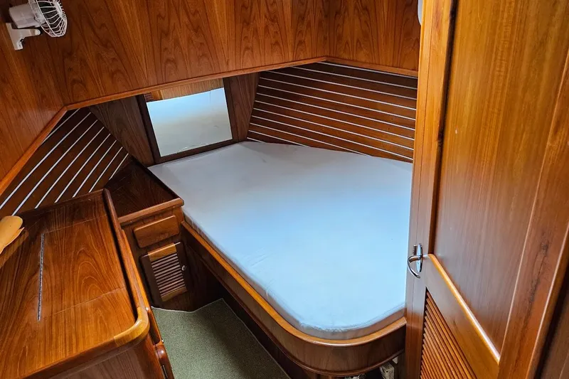 Carquinas Coot Yacht Photos Pics Cozy wooden cabin interior of 2010 Seahorse COOT boat with bed and fan.