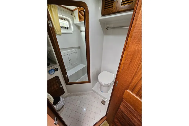 Carquinas Coot Yacht Photos Pics 2010 Seahorse COOT boat bathroom with wooden accents and compact design.