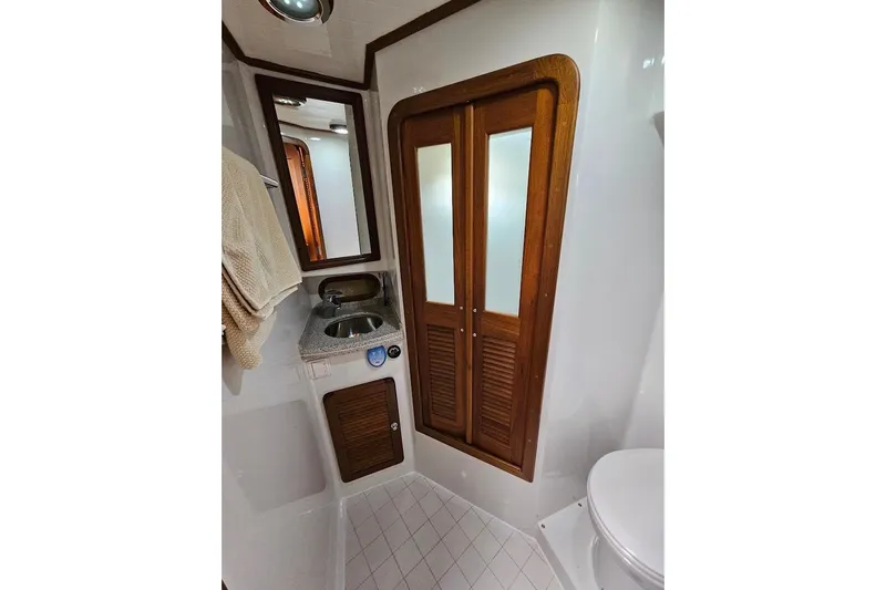 Carquinas Coot Yacht Photos Pics Compact bathroom in 2010 Seahorse COOT boat with wooden accents and modern fixtures.