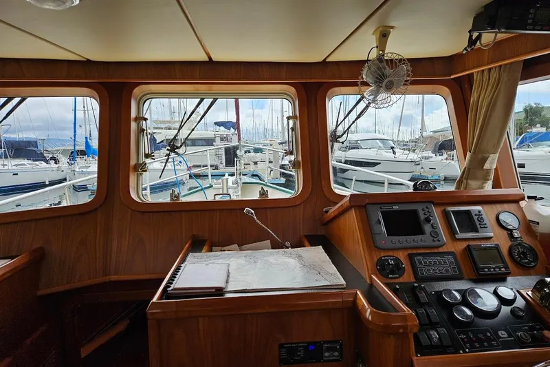 Carquinas Coot Yacht Photos Pics Pilot house interior of 2010 Seahorse COOT boat with navigation equipment and marina view.