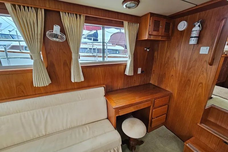 Carquinas Coot Yacht Photos Pics Cozy 2010 Seahorse COOT boat interior with wooden desk, seating, and window view.