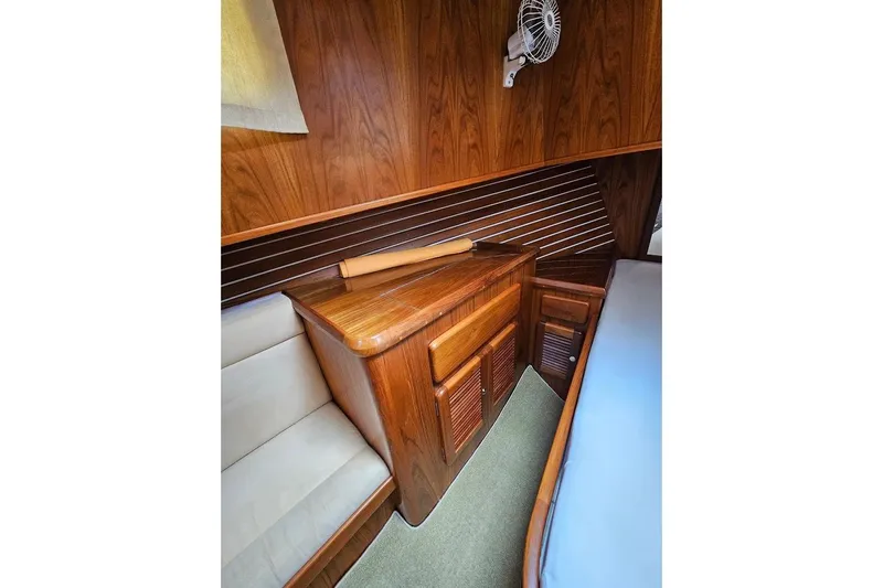 Carquinas Coot Yacht Photos Pics Cozy wooden interior of 2010 Seahorse COOT boat with seating and storage.