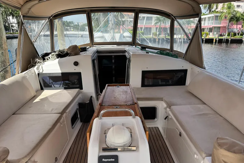 Reventador Yacht Photos Pics Interior view of 2018 Jeanneau Sun Odyssey 440 sailboat with seating and navigation equipment.