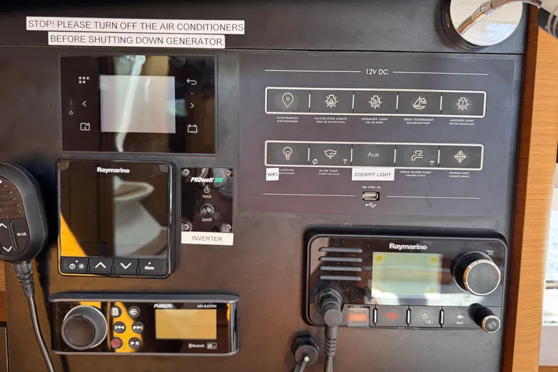 Reventador Yacht Photos Pics Control panel of a 2018 Jeanneau Sun Odyssey 440 sailboat with navigation and communication systems.