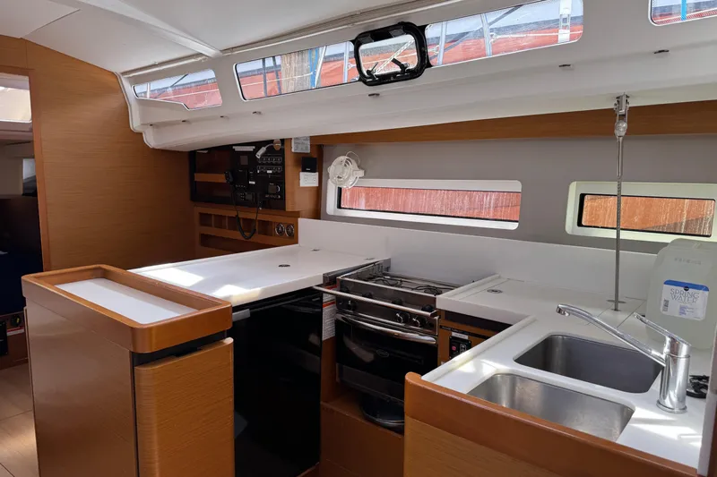 Reventador Yacht Photos Pics Interior of 2018 Jeanneau Sun Odyssey 440 yacht kitchen with modern amenities.