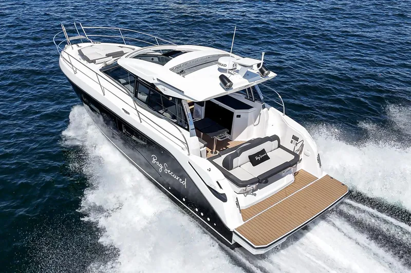 Bag Secured Yacht Photos Pics 2023 Bavaria SR36 yacht cruising on open water, showcasing sleek design and luxury features.