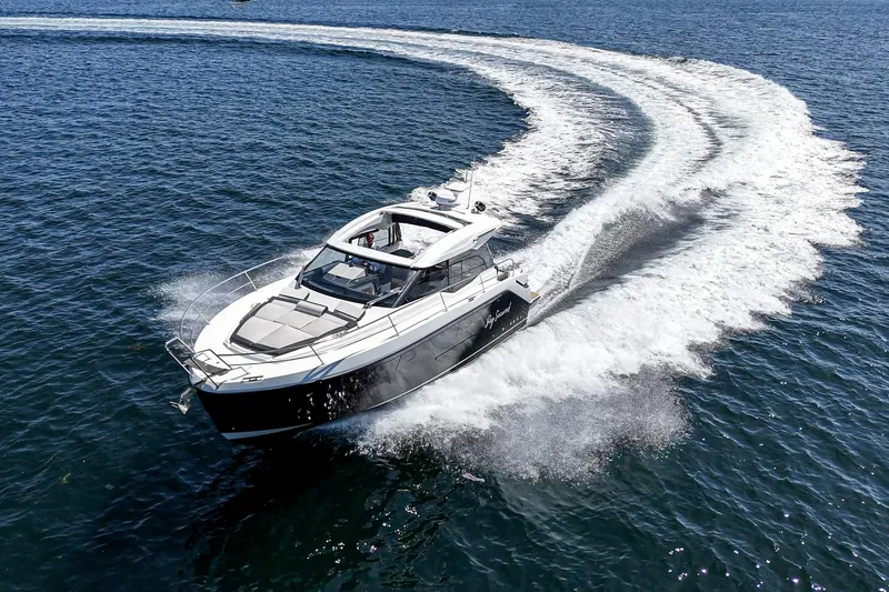 Bag Secured Yacht Photos Pics 2023 Bavaria SR36 yacht cruising swiftly on open water.
