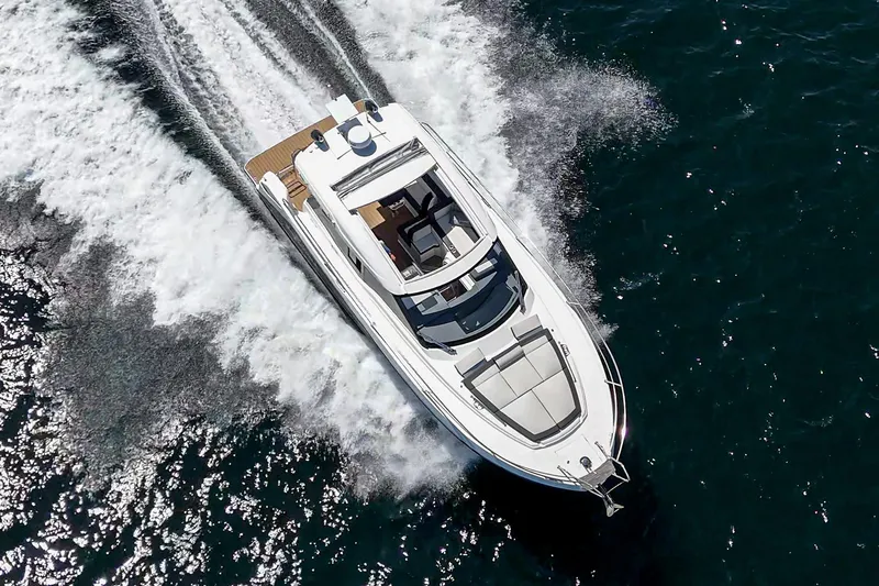 Bag Secured Yacht Photos Pics 2023 Bavaria SR36 yacht cruising on open water, aerial view.
