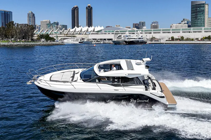 Bag Secured Yacht Photos Pics 2023 Bavaria SR36 yacht cruising in urban waterfront setting.