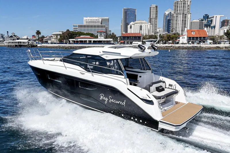 Bag Secured Yacht Photos Pics 2023 Bavaria SR36 yacht cruising in urban waterfront setting.