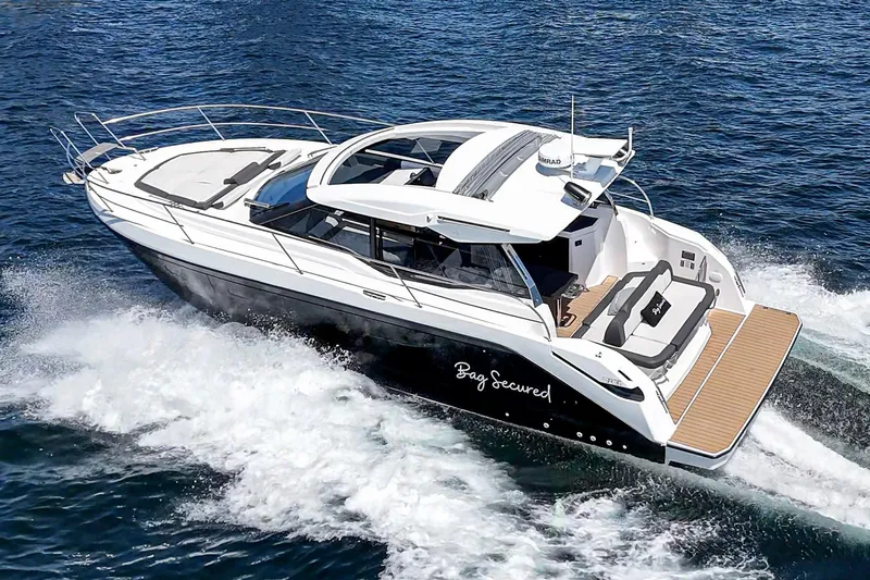Bag Secured Yacht Photos Pics 2023 Bavaria SR36 yacht cruising on open water, showcasing sleek design and luxury features.