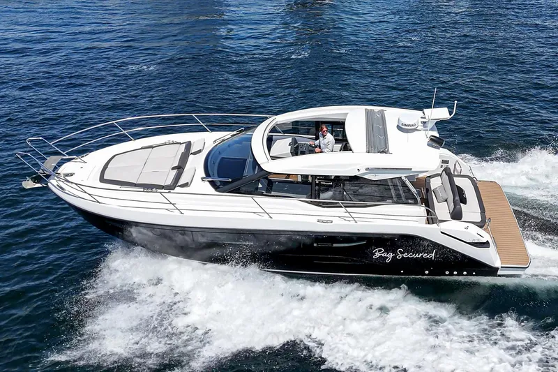Bag Secured Yacht Photos Pics 2023 Bavaria SR36 yacht cruising on open water, showcasing sleek design and luxury features.