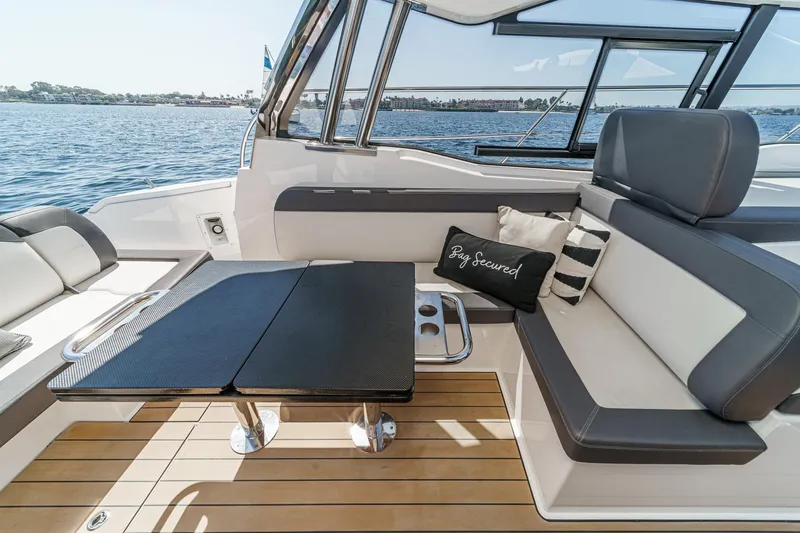 Bag Secured Yacht Photos Pics Luxurious seating area on 2023 Bavaria SR36 yacht with elegant table and cushions.