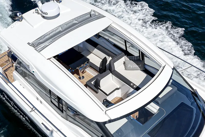 Bag Secured Yacht Photos Pics 2023 Bavaria SR36 yacht cruising on open water, featuring sleek design and spacious seating area.
