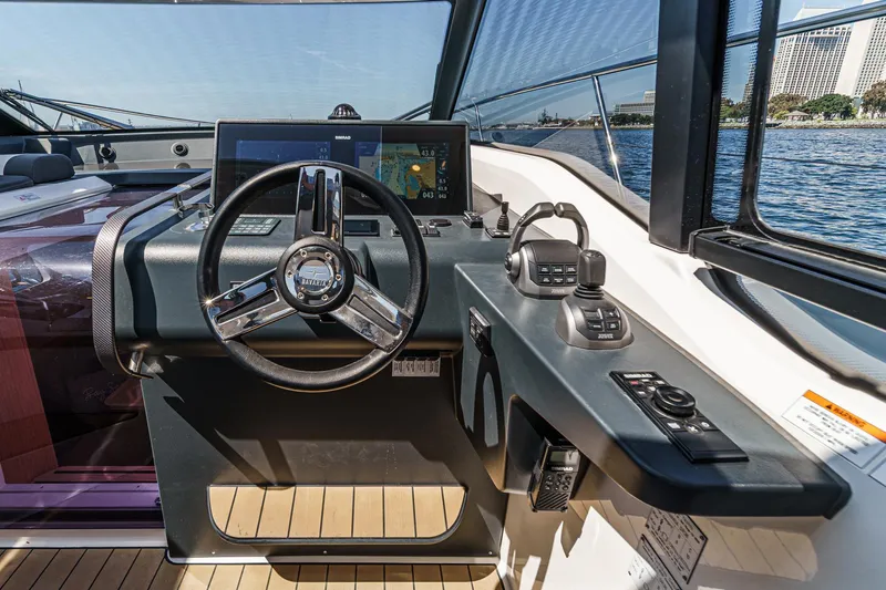 Bag Secured Yacht Photos Pics 2023 Bavaria SR36 yacht helm with modern navigation controls and steering wheel.