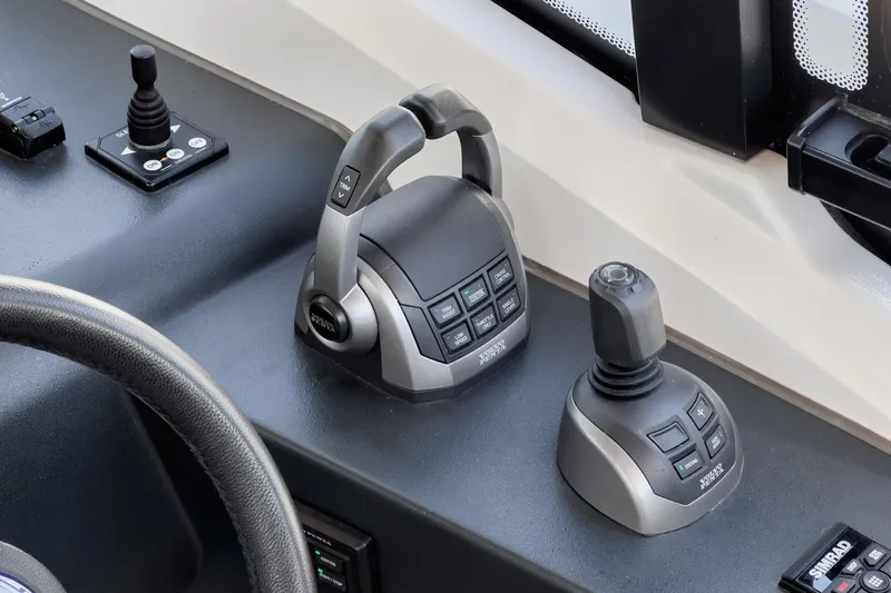 Bag Secured Yacht Photos Pics Control panel of 2023 Bavaria SR36 boat with advanced joystick and throttle controls.