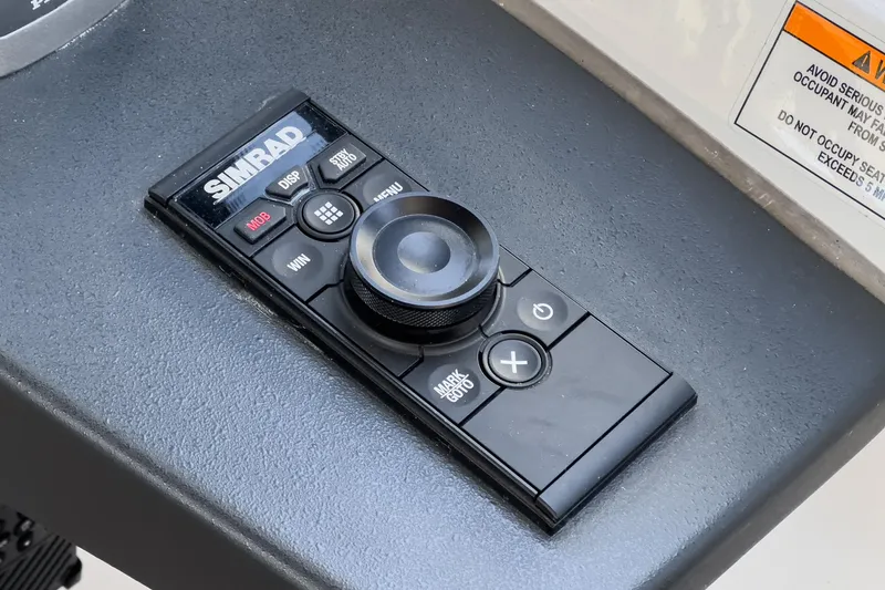 Bag Secured Yacht Photos Pics Simrad control panel on 2023 Bavaria SR36 boat dashboard.