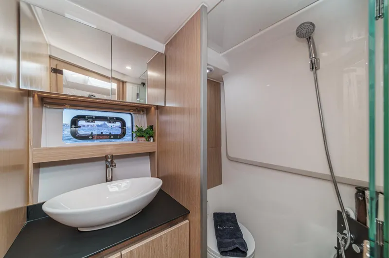 Bag Secured Yacht Photos Pics Modern bathroom in 2023 Bavaria SR36 yacht with sleek sink and shower.