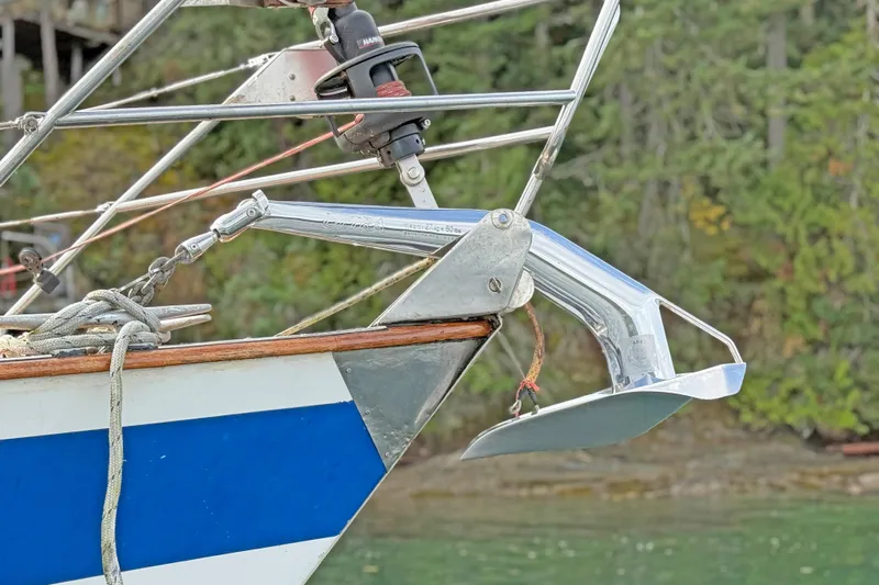 Raison D'etre Yacht Photos Pics Bow of 1988 Hallberg Rassy 42E sailboat with anchor and rigging details.