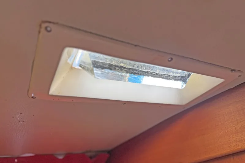 Raison D'etre Yacht Photos Pics Ceiling light fixture inside 1988 Hallberg Rassy 42E yacht cabin.