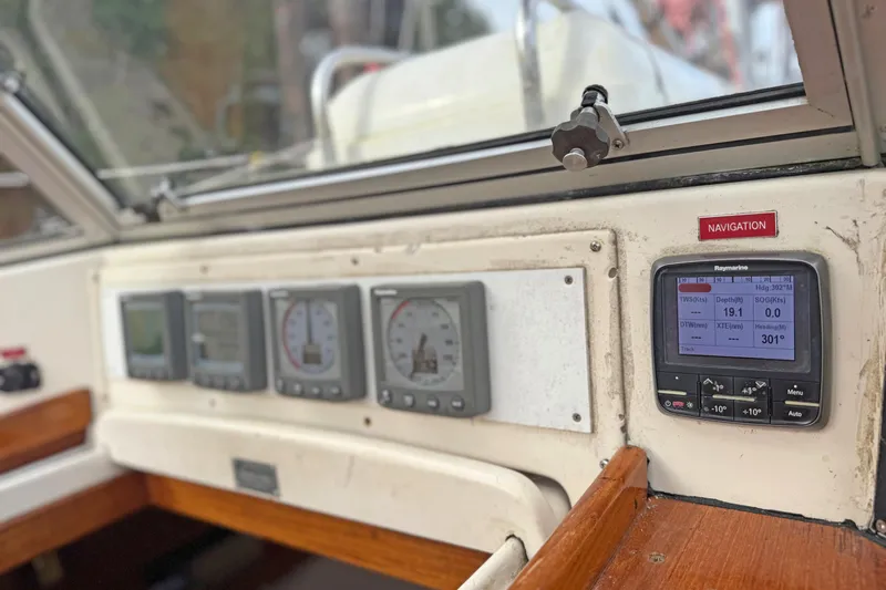 Raison D'etre Yacht Photos Pics Cockpit navigation instruments on a 1988 Hallberg Rassy 42E sailboat.