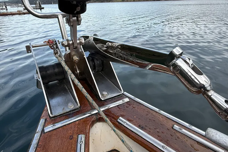 Raison D'etre Yacht Photos Pics Bow of 1988 Hallberg Rassy 42E yacht with Ultra anchor, docked on calm water.