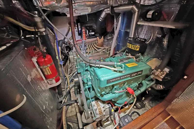 Raison D'etre Yacht Photos Pics Engine room of 1988 Hallberg Rassy 42E with Volvo Penta D2-75 engine.