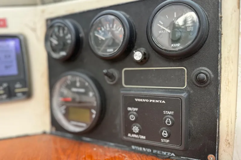 Raison D'etre Yacht Photos Pics Control panel of a 1988 Hallberg Rassy 42E sailboat with Volvo Penta gauges.