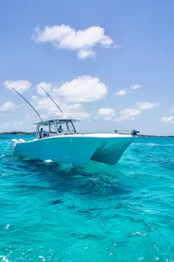  Yacht Photos Pics Front Runner 43 Catamaran 2026 cruising on clear turquoise waters under a bright blue sky.