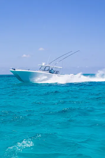  Yacht Photos Pics Front Runner 43 Catamaran cruising on turquoise waters under clear blue sky, 2026 model.