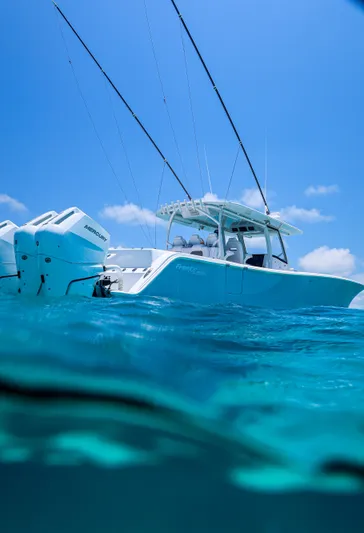  Yacht Photos Pics 2026 Front Runner 43 Catamaran on clear blue water under a sunny sky.
