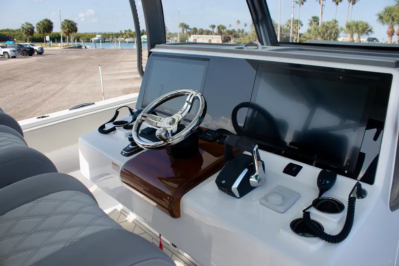  Yacht Photos Pics Helm of 2026 Front Runner 43 Catamaran with modern controls and dual screens.