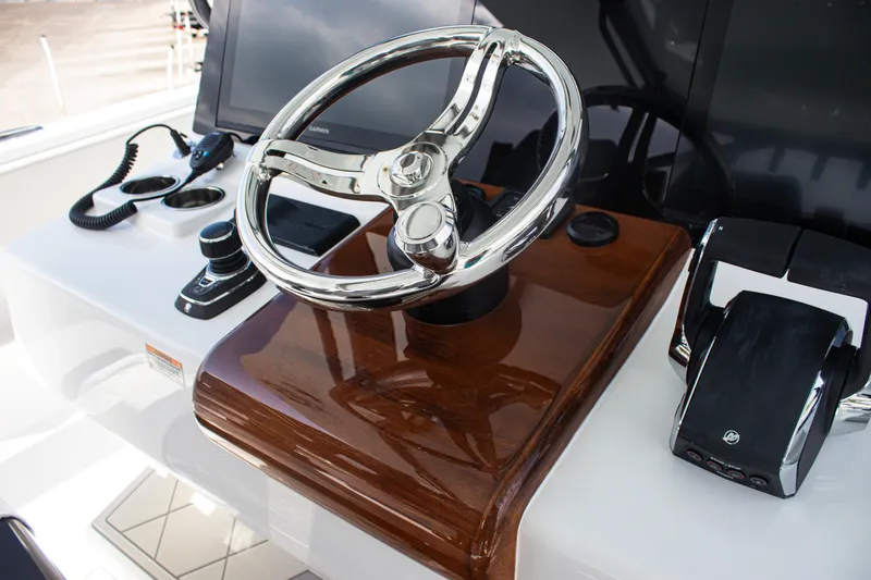  Yacht Photos Pics Steering wheel and controls of 2026 Front Runner 43 Catamaran, featuring sleek design and modern technology.