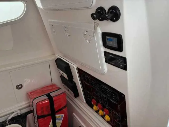 Black Label Marine Yacht Photos Pics Interior view of 2023 Sea Fox 328 Commander boat with control panel and safety equipment.