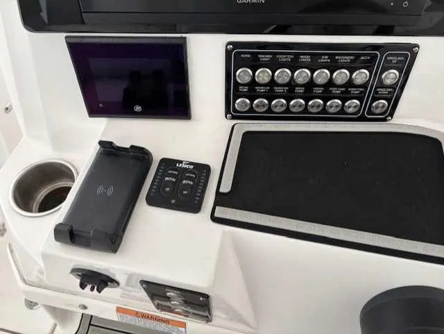 Black Label Marine Yacht Photos Pics Control panel of 2023 Sea Fox 328 Commander boat with switches and electronic devices.