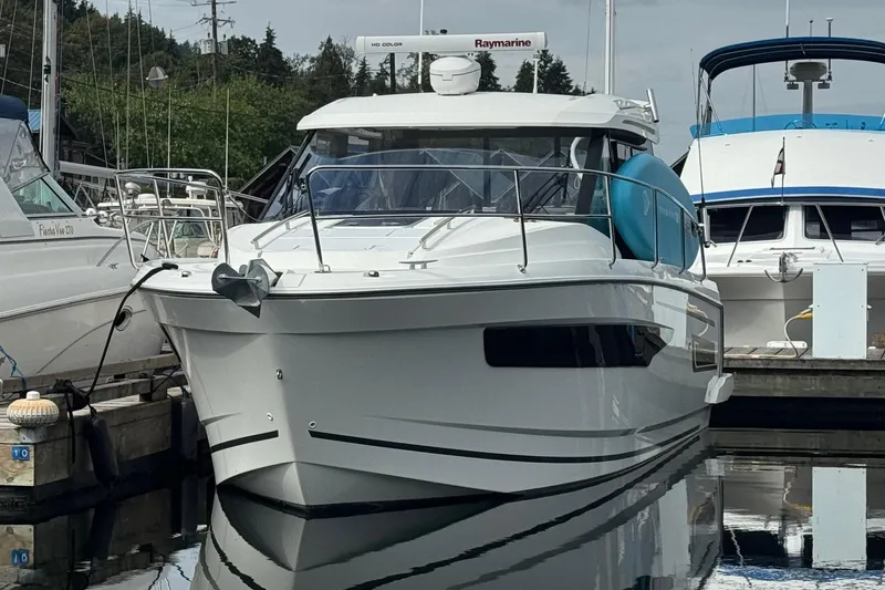  Yacht Photos Pics 2017 Jeanneau 895 Offshore boat docked at marina, featuring sleek design and modern equipment.