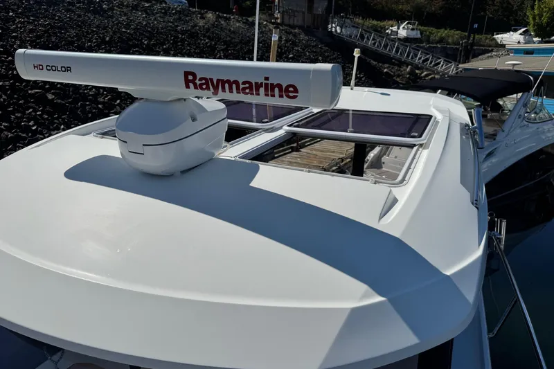  Yacht Photos Pics 2017 Jeanneau 895 Offshore boat with Raymarine radar, docked at marina.