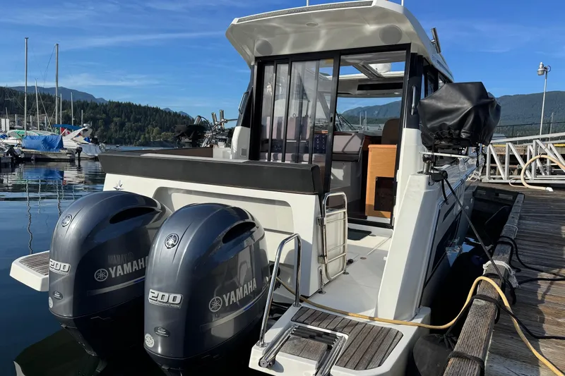  Yacht Photos Pics 2017 Jeanneau 895 Offshore boat with twin Yamaha 200 engines docked at marina.