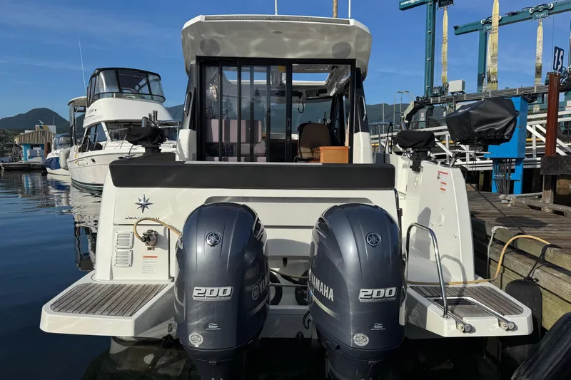  Yacht Photos Pics 2017 Jeanneau 895 Offshore boat with twin Yamaha 200 engines docked at marina.