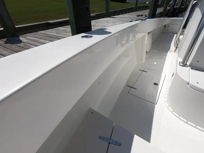  Yacht Photos Pics 2003 Venture 34 Open boat deck, clean and spacious with white finish.