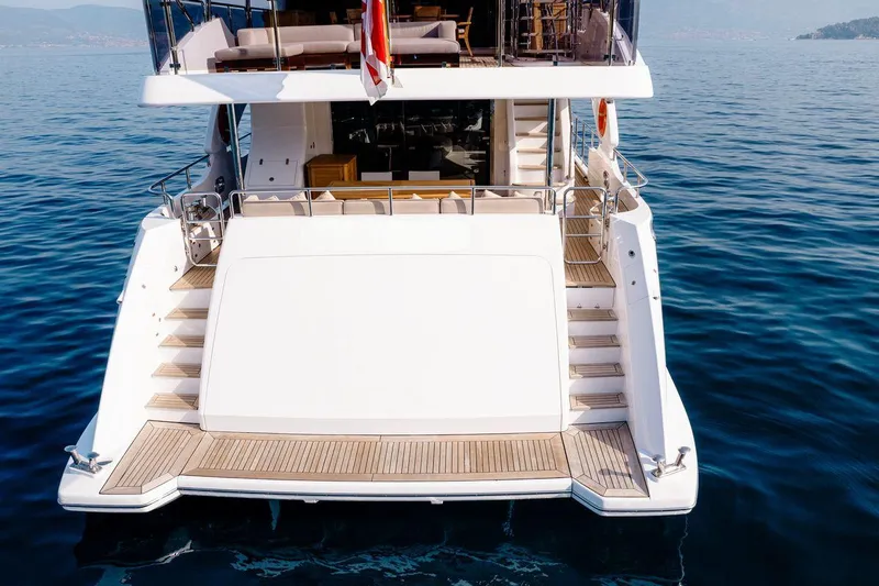 Afina Yacht Photos Pics Luxury Benetti 108 yacht, 2017 model, featuring elegant deck design on calm blue waters.