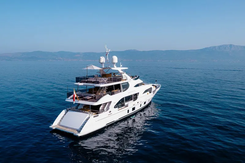 Afina Yacht Photos Pics Luxurious 2017 Benetti 108 yacht cruising on serene blue waters.