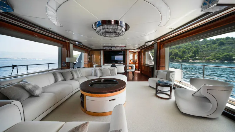 Afina Yacht Photos Pics Luxurious interior of 2017 Benetti 108 yacht with elegant seating and ocean view.