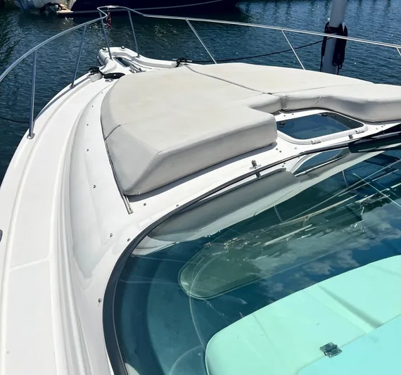 Nola Yacht Photos Pics 2007 Tiara Yachts 3900 Sovran deck with sunpad, docked on calm water.