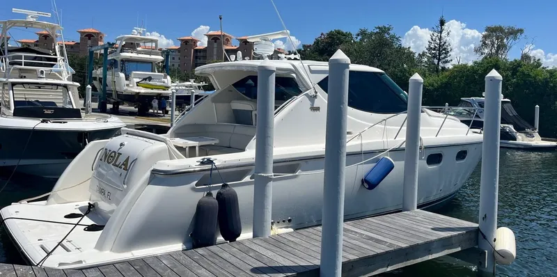 Nola Yacht Photos Pics 2007 Tiara Yachts 3900 Sovran docked at marina under clear blue sky.