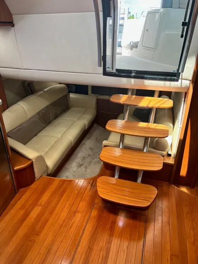 Nola Yacht Photos Pics Interior of 2007 Tiara Yachts 3900 Sovran with wooden flooring and modern seating.