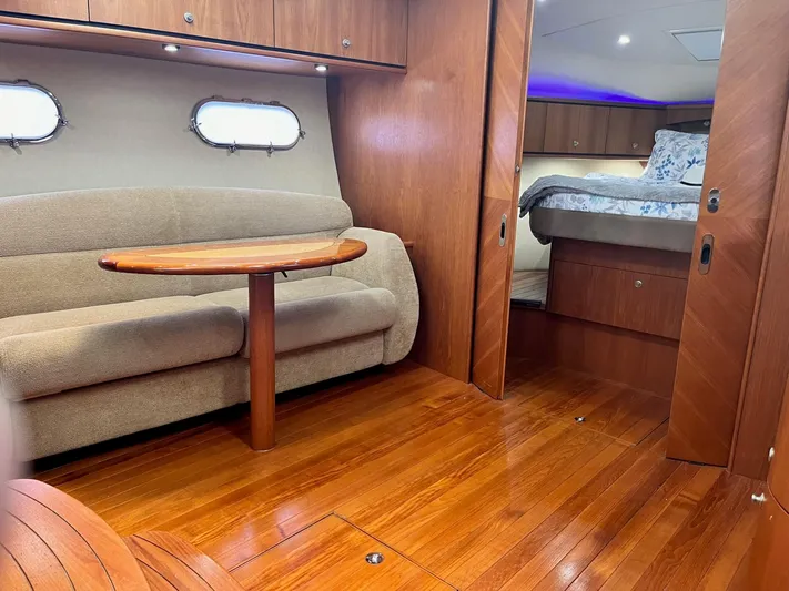 Nola Yacht Photos Pics Luxurious 2007 Tiara Yachts 3900 Sovran interior with wood flooring and cozy seating area.
